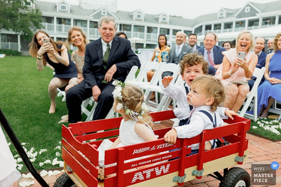 Photo by: <a href="https://www.wpja.com/contests/2019-v09/best-wedding-photographers/2538471">Alex Paul - Boston Massachusetts</a> Nantucket, MA White Elephant Weddings - Photography of kids during the ceremony