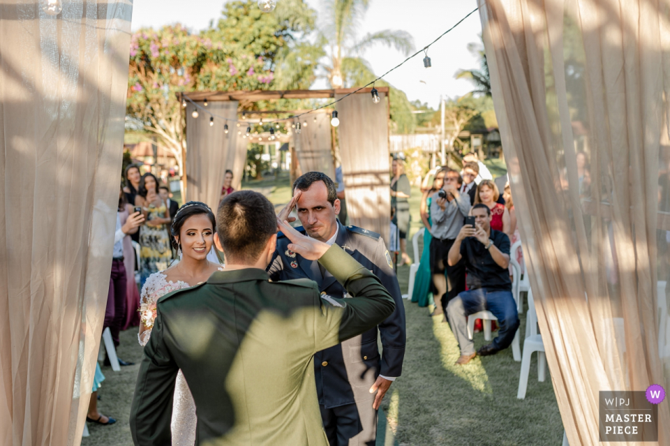 High Patent Police Officer saluting the groom Brazil's army officer Outdoor Wedding Ceremony Venue: Cerimonial Sítio Santa Clara - Aracruz, Espírito Santo, Brazil - Photo of the Bride's father (High Patent Police Officer) saluting the groom (Brazil's army officer)