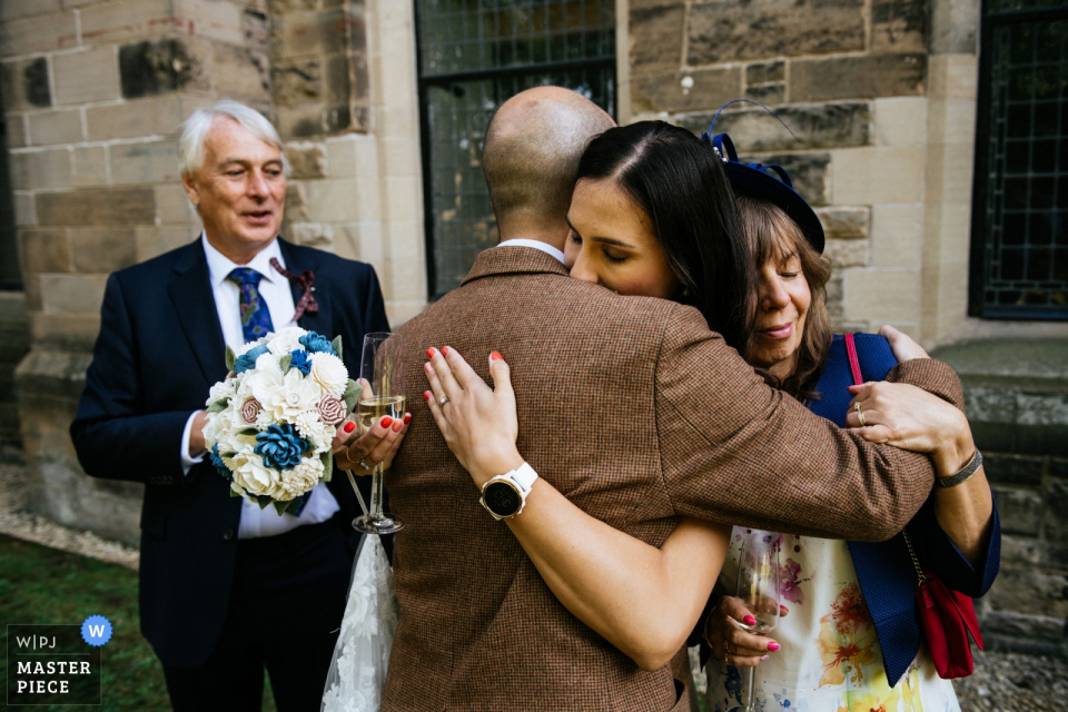 Bride with her family during the drinks reception Mansfield Traquair, Edinburgh wedding image contains: Bride with her family during the drinks reception