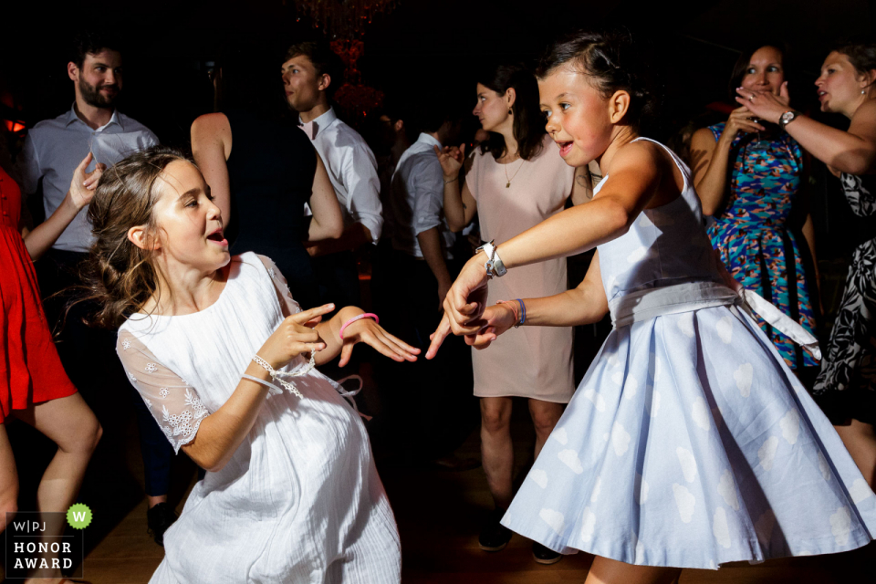 young flower Girls are dancing during the party Château du domaine de la Châsse wedding venue photo | Girls are dancing during the party