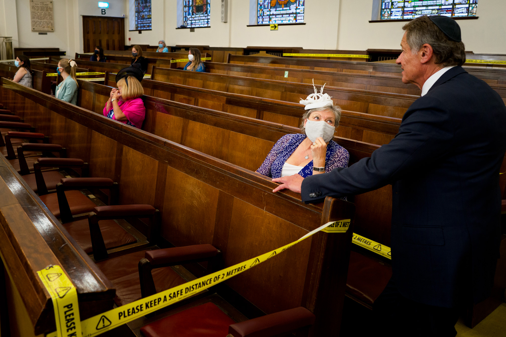 United Kingdom, Central Synagogue Wedding Photo - caution tape, masks, and social distancing of the wedding guests Central - United Synagogue Wedding Elopement Photography | Evidence of the new COVID-19 guidelines in force