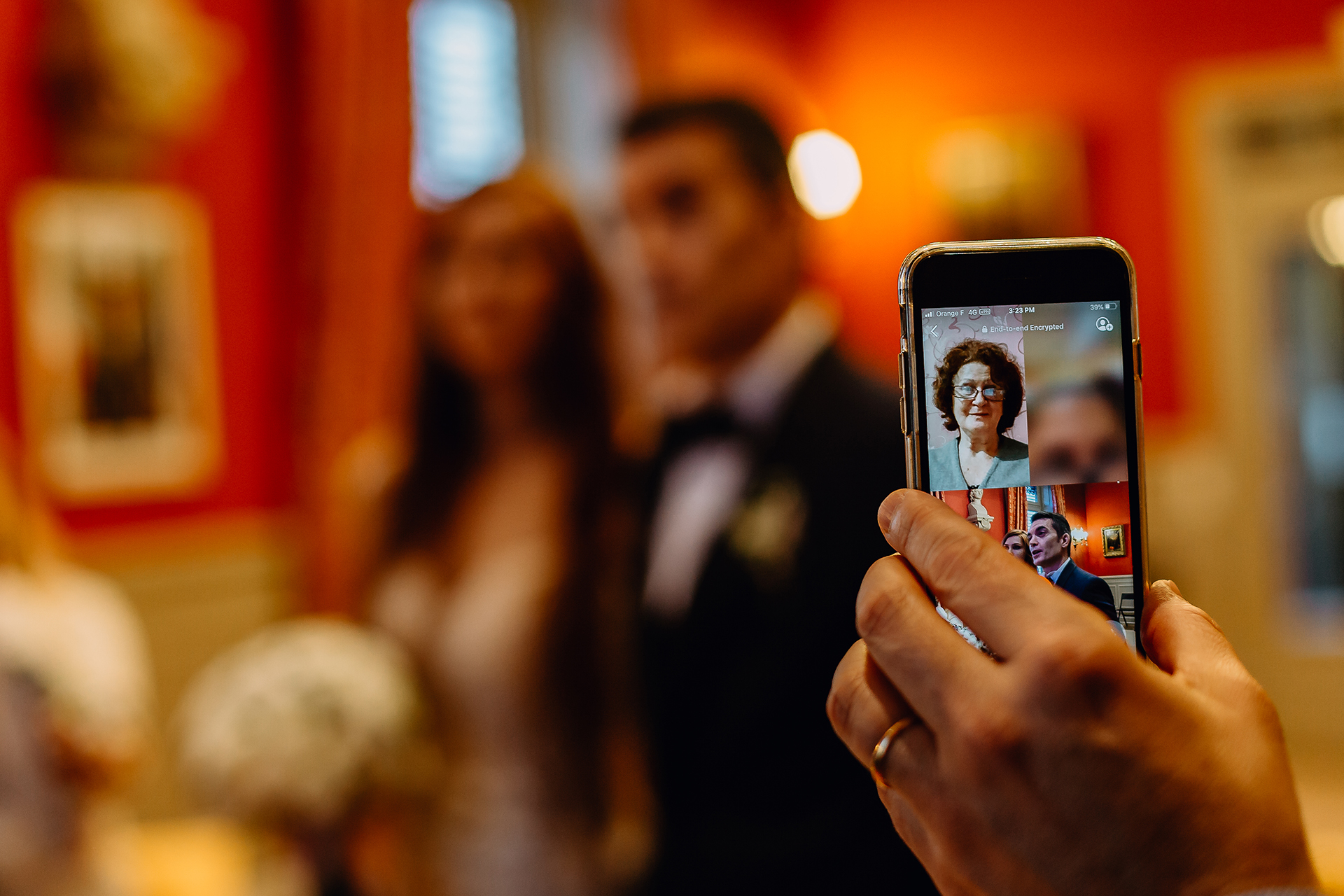 Rhône Town Hall Civil Wedding Ceremony Image | The bride and groom's families follow the ceremony by a video call