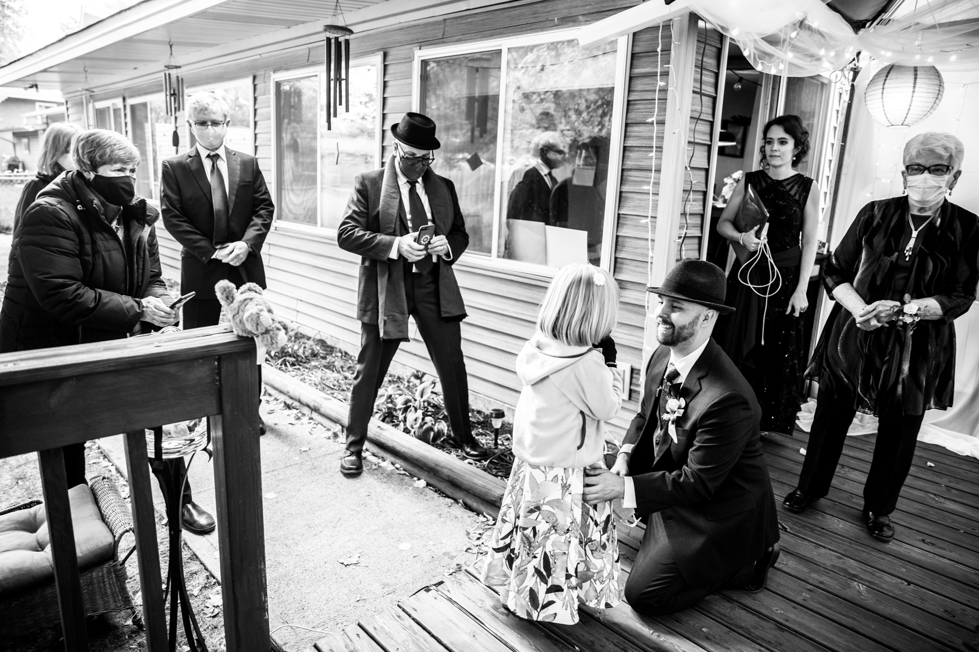 MN Elopement Picture - the groom gets a pep-talk from his daughter Minneapolis Wedding Photographer | Family and friends gather together before the backyard ceremony