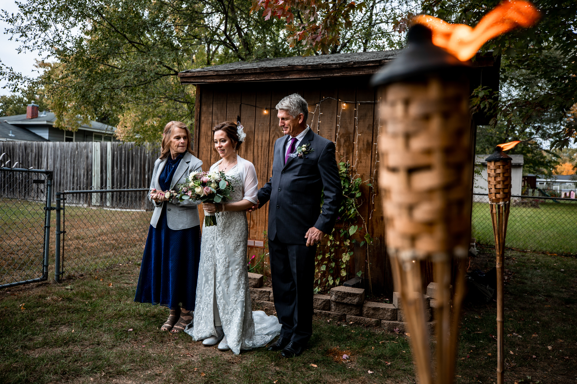 MN Outdoor Elopement Picture - mother and uncle escort the bride to the ceremony Minneapolis Documentary Wedding Image | The bride is being escorted