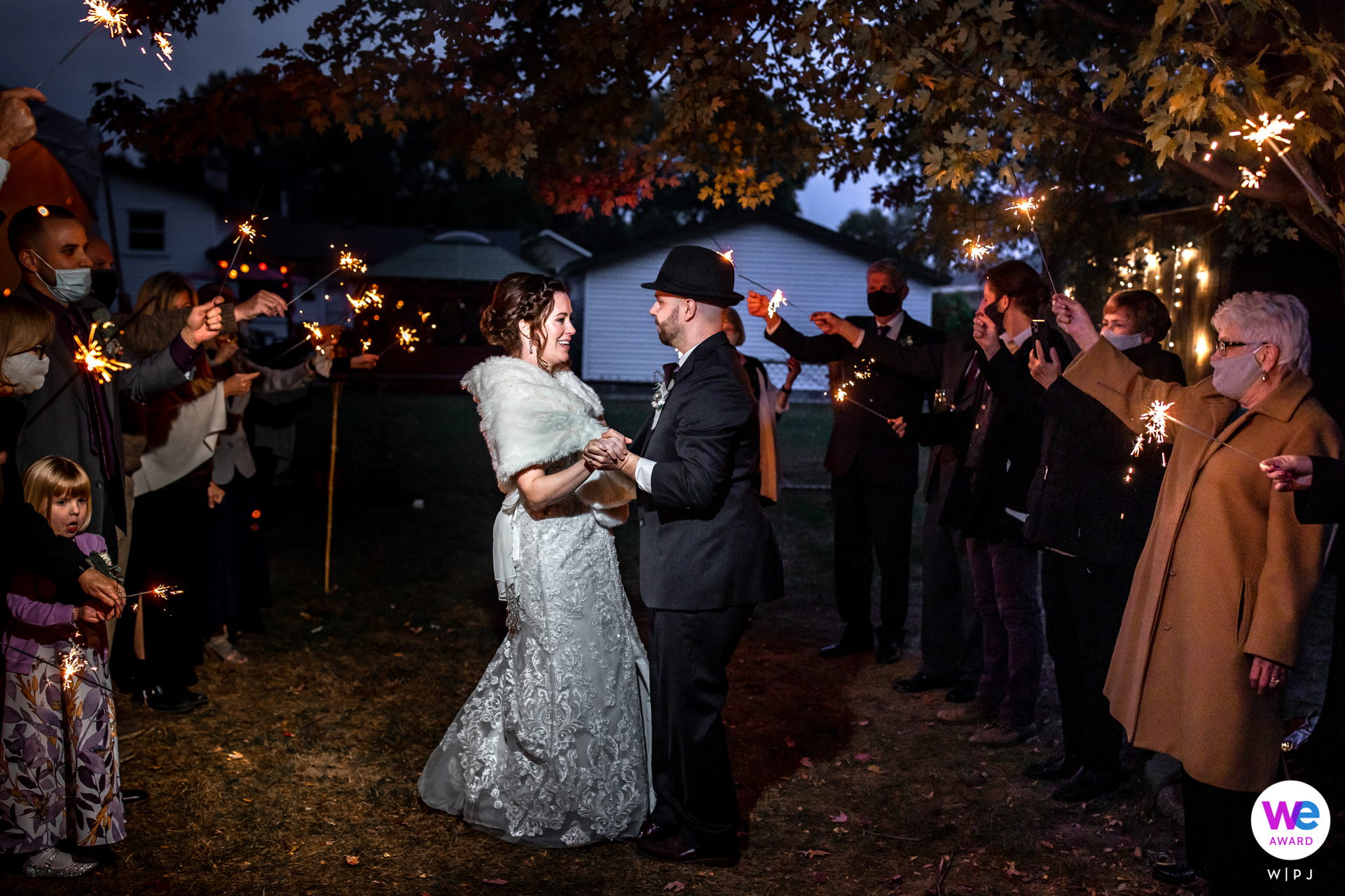 At the end of the reception party, the happy couple wowed their guests by dancing together in the sparkler-lit venue