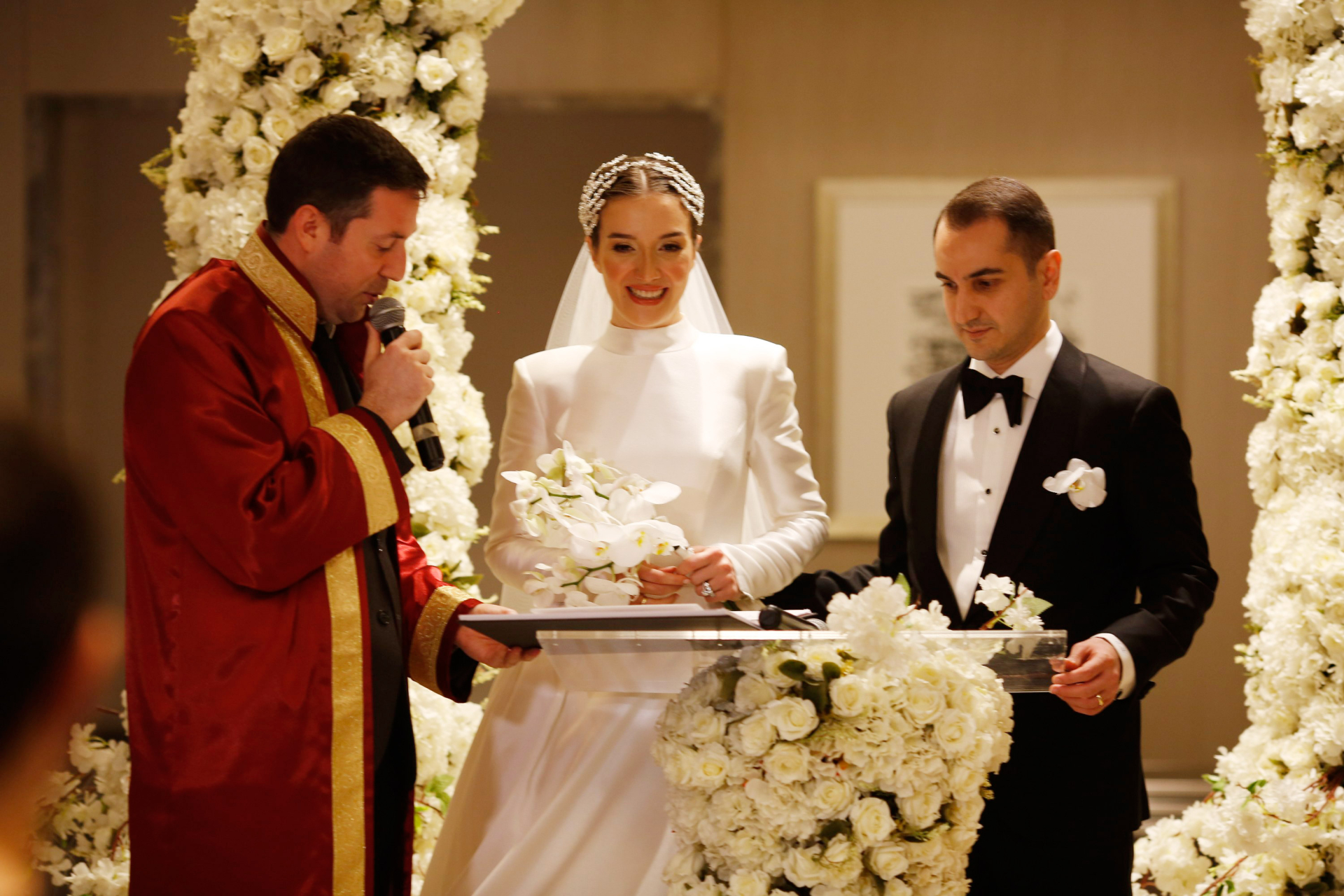 The newlyweds said "I do" at The Address Hotel in Istanbul, Üsküdar, amidst a beautiful floral altar The bride and groom exchange their vows at a ceremony in Istanbul's The Address Hotel, Üsküdar