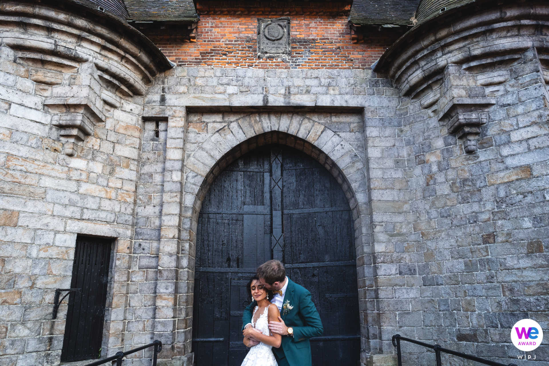 Capturing a couple's eternal love, framed by an enchanting old world door. A truly timeless wedding photo.
