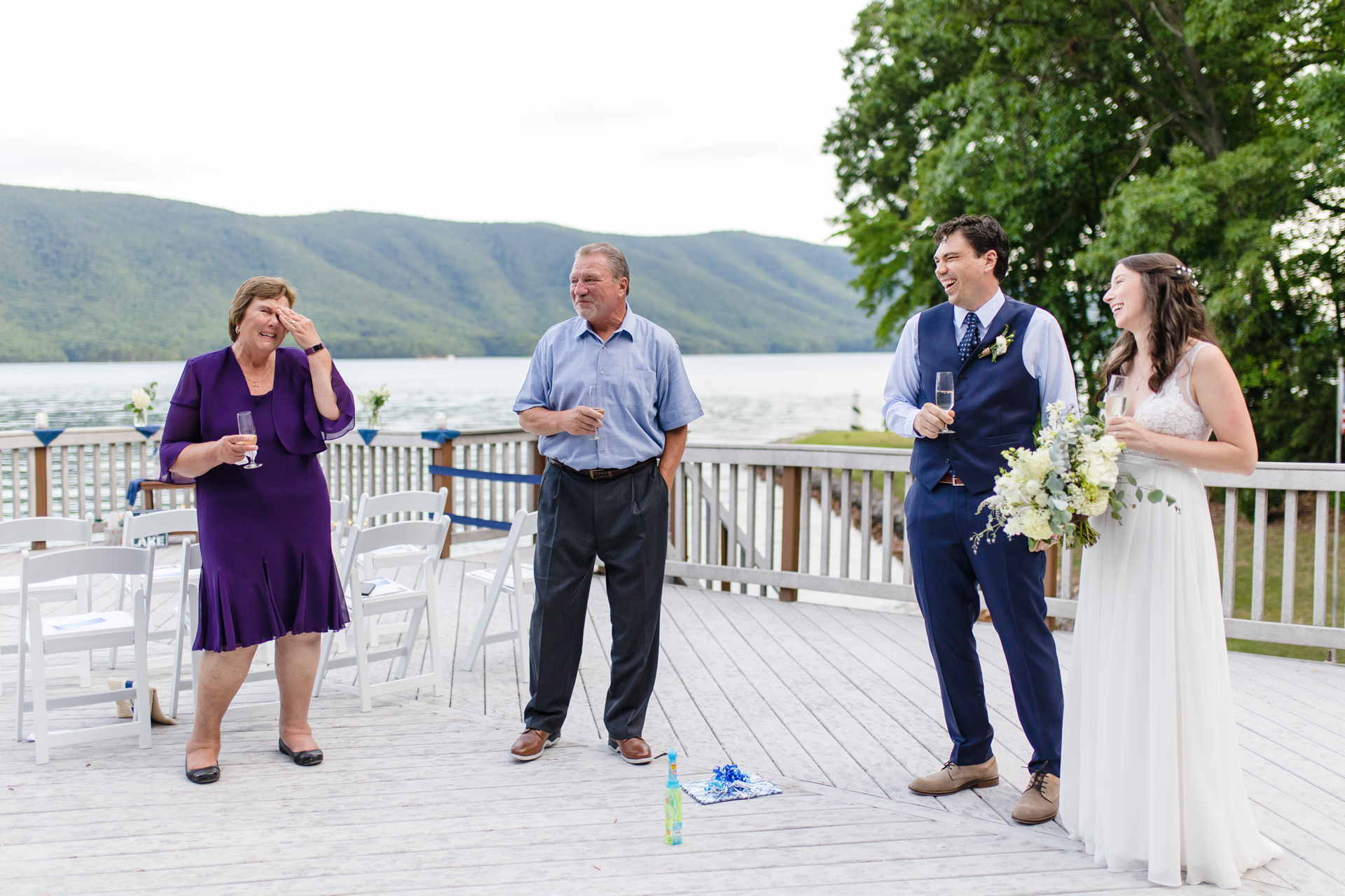 Groom's mother becomes emotional during toasts at intimate Smith Mountain Lake elopement ceremony.