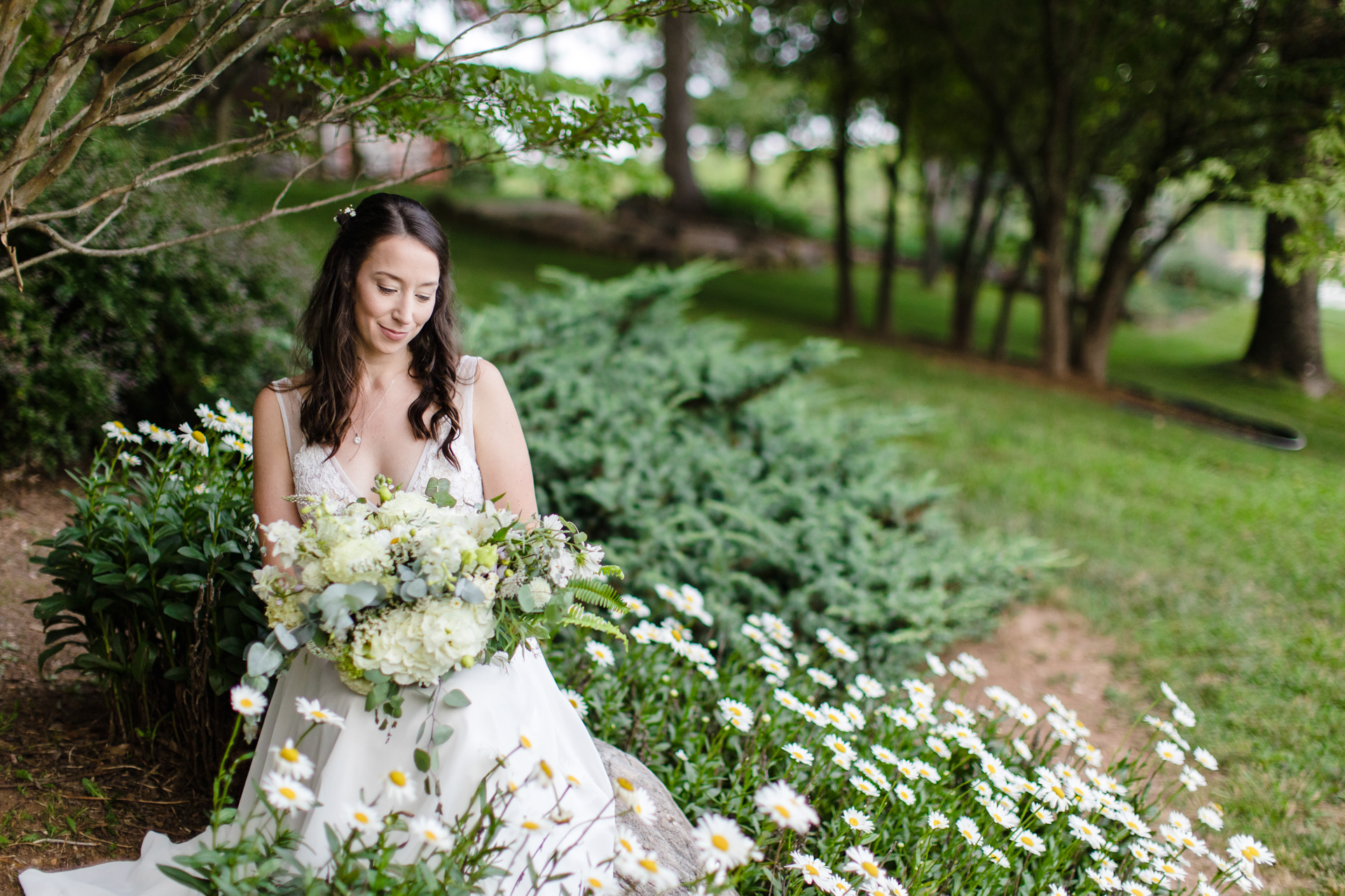 Bridal portrait surrounded by daisies captures the essence of an intimate Smith Mountain Lake elopement.