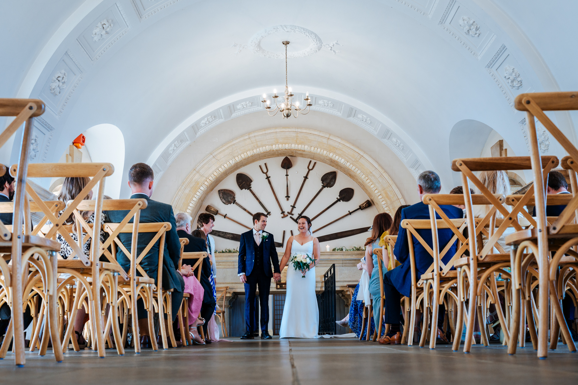 Low-angle view of Normanton Church's architecture as newlyweds get ready to walk down the aisle.